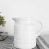 White Ceramic Pitcher With Embossed Lines